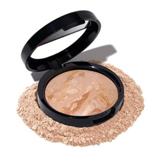 Open compact powder with scattered powder around.