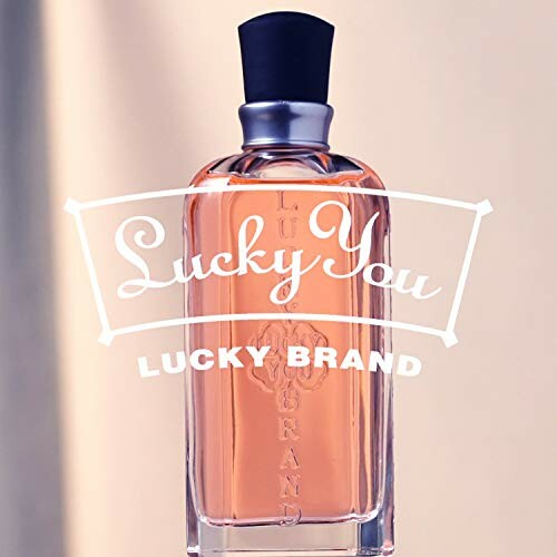 Lucky You perfume bottle with orange liquid and black cap