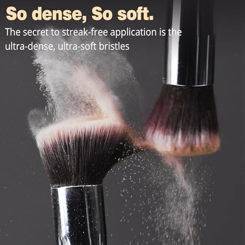 Two makeup brushes with soft bristles creating a powdery effect.