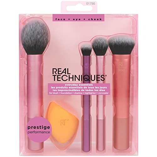 Real Techniques makeup brush set with four brushes and a sponge.