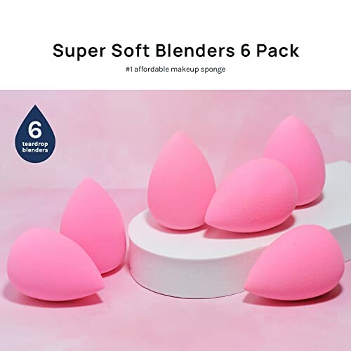 Set of six pink teardrop makeup blenders on a pink background