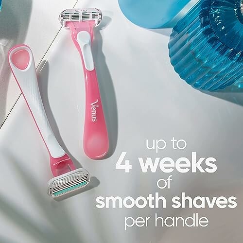 Two Venus razors with text promoting four weeks of smooth shaves.