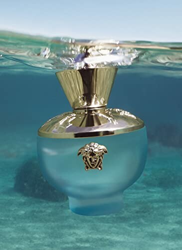 Versace perfume bottle partially submerged underwater.