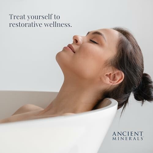 Woman relaxing in a bathtub promoting restorative wellness.